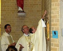 Bishop Kieran and Fr Kieron anointing the walls of the church during the Consecration Mass